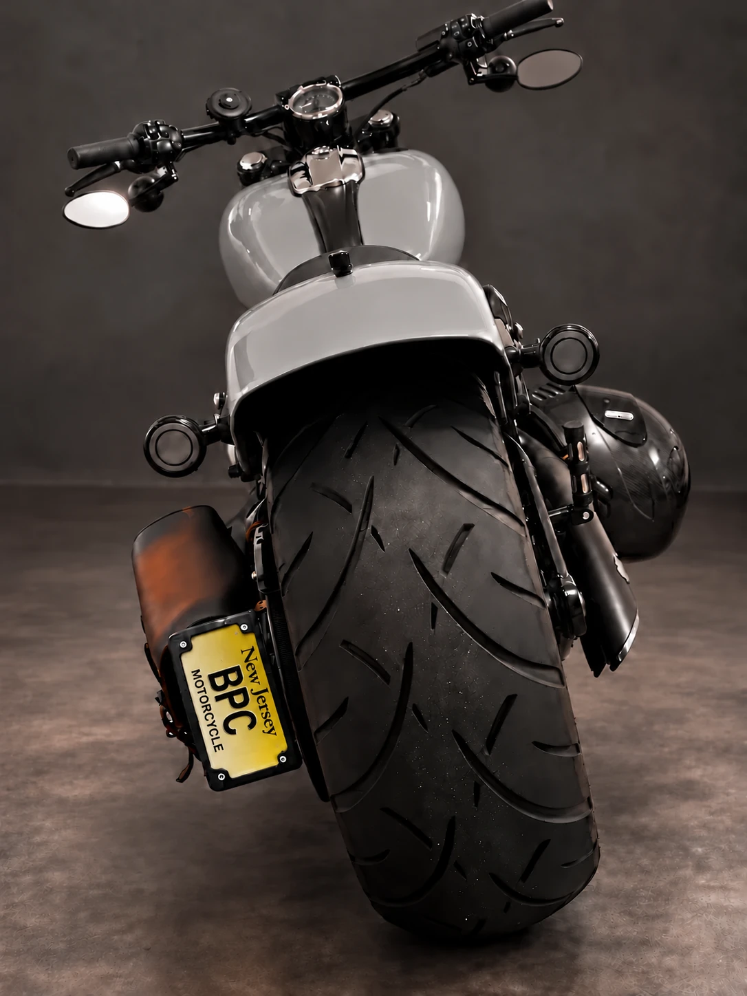 260 mm rear tire and yellow BPC plate on the Garbage Can Grey Harley rebuild